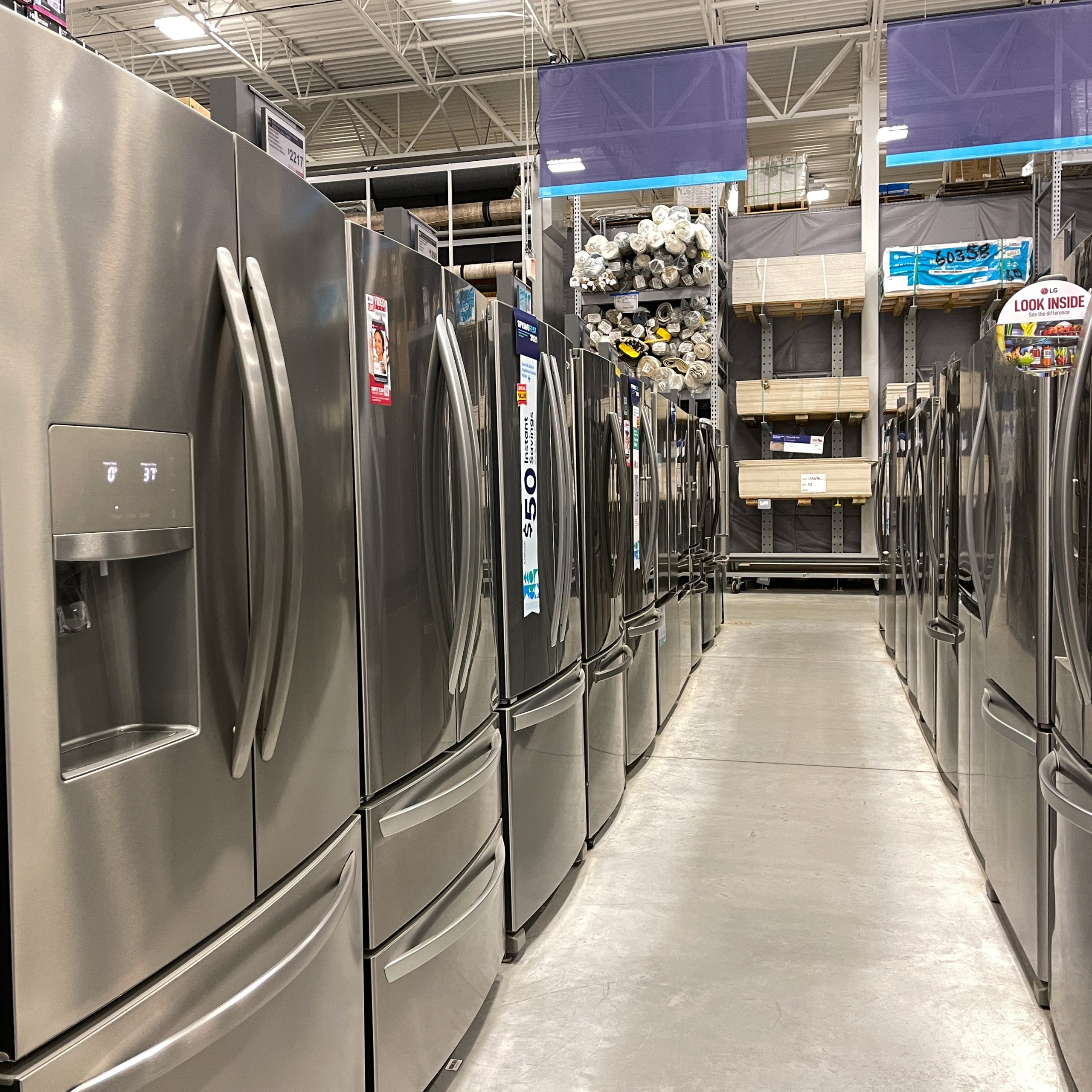 A row of refrigerators for sale at Lowes Home Improvement hardw