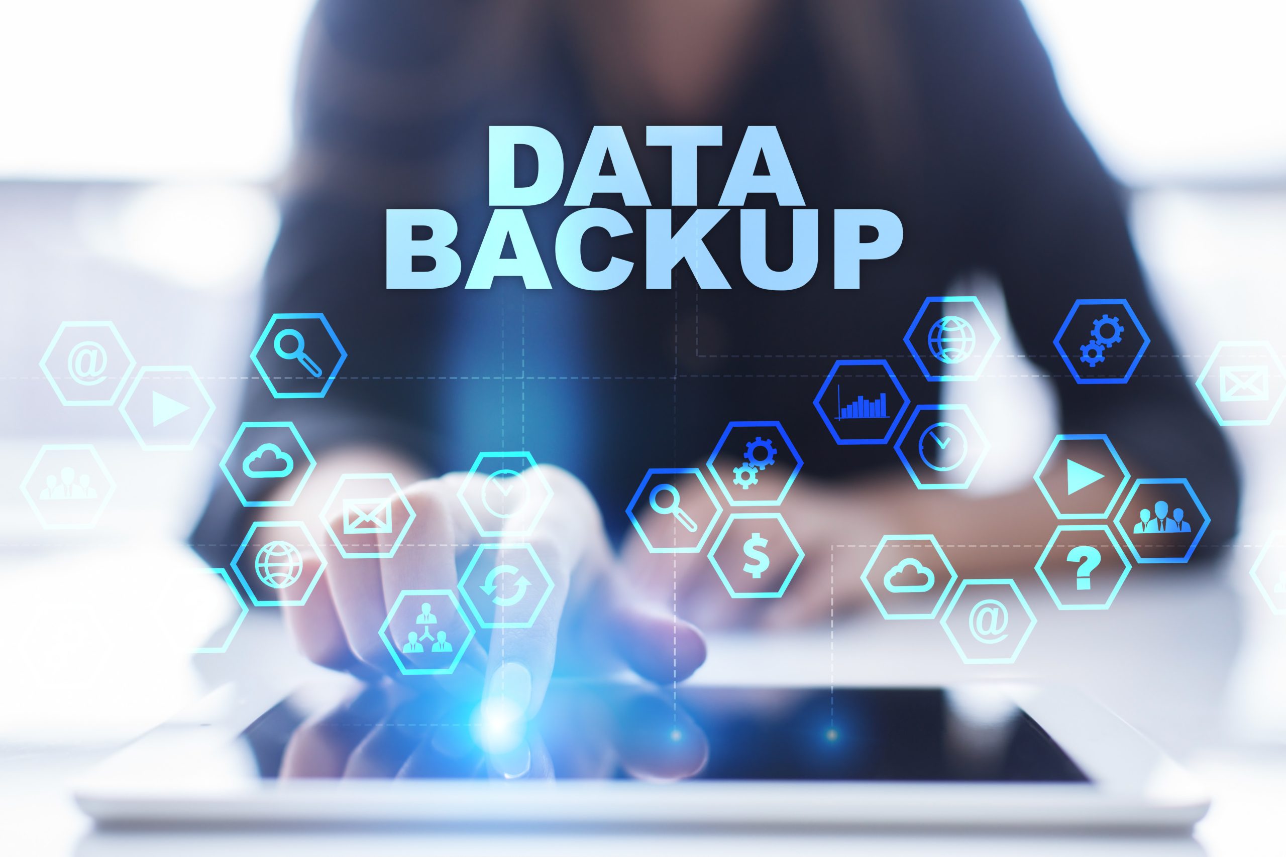 Woman is using tablet pc, pressing on virtual screen and selecting data backup